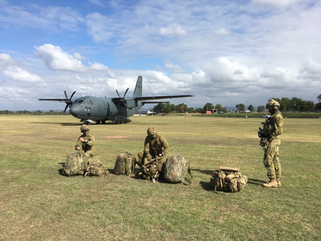 Members of 2 CDO conduct an assault landing alongside a Spartan. Credit: ADM Ewen Levick