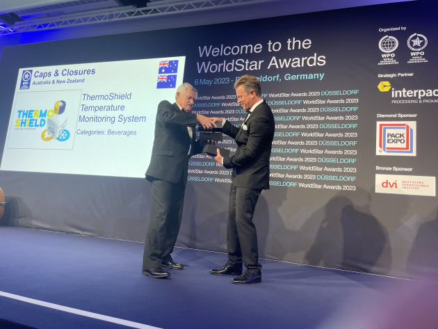 Weighed down by awards, what a problem to have. Caps & Closures MD Brendon Holmes receives his stash from WPO President Pierre Pienaar.