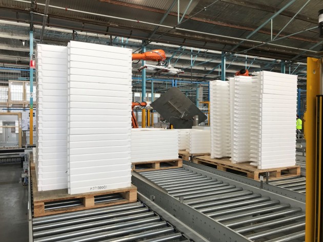 EPS Sides pallet stacks on magazine conveyors. Six magazines with multiple accumulation zones allowing for two hours of unattended run time.