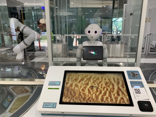 Pepper takes the order, while Kuka cobot Eka stands by to scoop.
