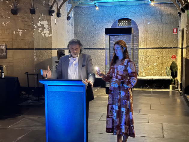 Chair Rob Marguccio (left) gave an update on APPMA Board activities, with reading light assistance from APPMA marketing team member Emily McGuiness.