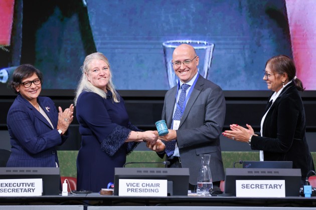 Vice-chair Johanna Lissinger-Peitz, Sweden, passing the gavel to new INC chair Julio Cordano, Chile