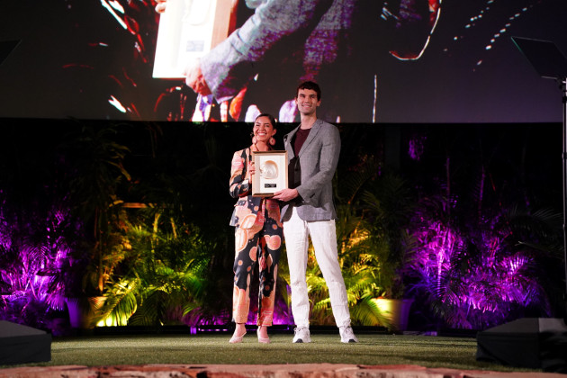 Jack Tuftie accepts award for Melissa Greenwood, Miimi & Jiinda x Gilat Shani, Unreal Fur, Community Collaboration Award, Supported by Canberra Centre, National Indigenous Fashion Awards, 2024, Photo by Dyla