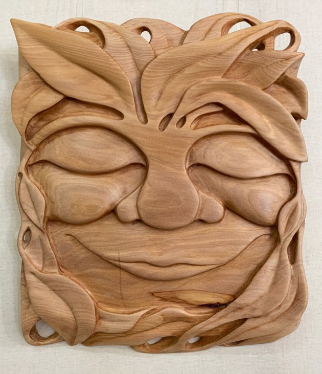 Jade Lobenstock, Serenity, bunya. "I first discovered my love of timber and woodcarving around 10 years ago, when I picked up a little piece of beech and a small file and started carving a face...a smile. Then I was generously gifted a set of chisels and everything clicked. Largely self-taught, I go by feel. Starting with selecting the piece of timber...it needs to "speak" to me; show me a glimpse of it's magic, it's potential. I only work with ethically sourced timber, and prefer a natural finish that actually feeds the wood, bringing out the beauty in the grain. I mainly carve smiling faces, loving the effect they have on the person viewing them. In this fast-paced world, my aim as an artist is to bring a slow smile to the face (and to the heart!) of the viewer. That to me is success."