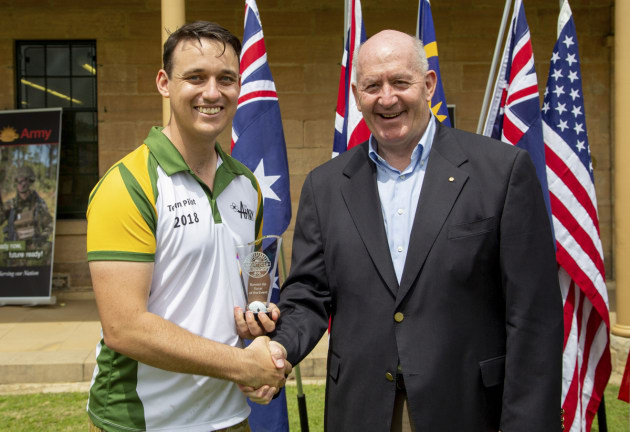 Governor-General Sir Peter Cosgrove presents Captain James Jenkins the runner up trophy for the International Drone Racing Tournament.
Defence