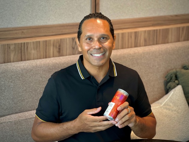 Kakadu Kitchen founder Ben Tyler, holding his collaboration with ALTD.