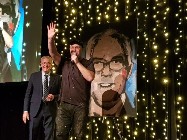 Fast painting: WPO lifetime achievement winner Keith Chessell, (left) with his portrait, knocked up by Brad Blaze in less than five minutes, keeping the crowd entertained at the PIDA gala dinner