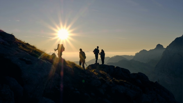 Happy hikers. Kristjan Kotar/Unsplash