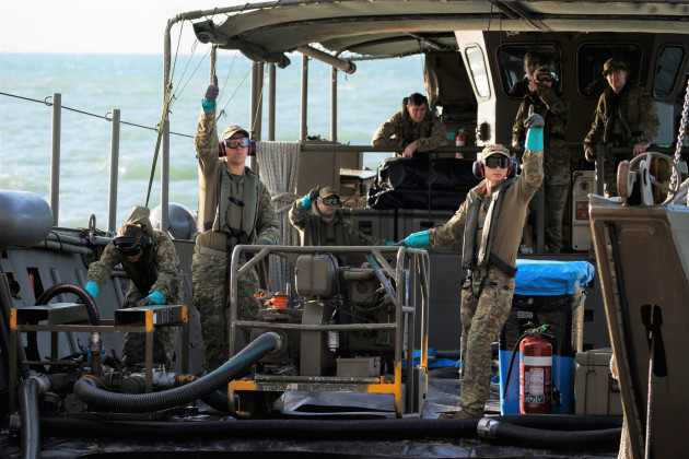 Petroleum Operators from 17th Sustainment Brigade pump fuel from an LCM8 to land during Exercise Overland - Nautical Petros 22, at Cowley Beach Training Area in Queensland. (Defence)