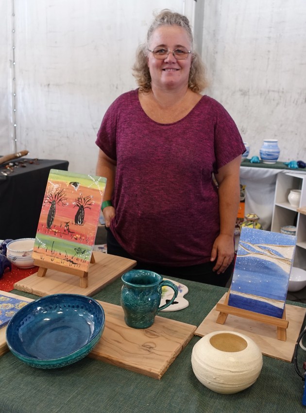 Liv White on Lana Vikulov's Motion to Mould pottery class stand. Liv's work is shown in the foreground.