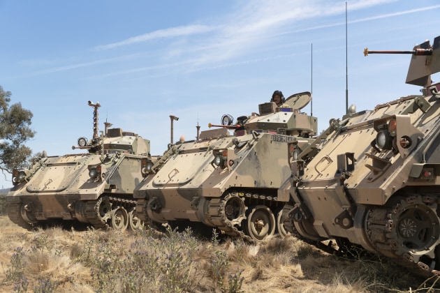 Corporal Josh Green commands a M113AS4 and two autonomous M113 AS4 optionally crewed combat vehicles (OCCV) during a demonstration at the Majura Training Area.
Defence