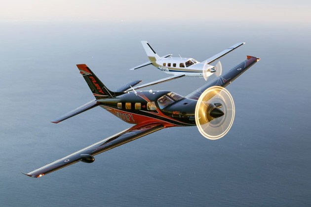 Piper's newest PA-46 model, the M700 Fury, leads a 1983 PA-46-301 Malibu. (Piper Aircraft)