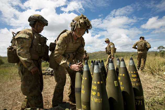 Australian Army soldiers from 8th/12th Regiment prepare rounds for the 155 mm M777A2 towed lightweight howitzer. Credit: Defence