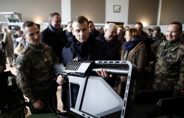 French President Emmanuel Macron handles the DroneGun Tactical during a visit to French Army Camp Mourmelon. Credit: DroneShield