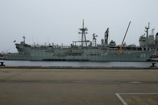 HMAS Melbourne is fully wrapped from bow to stern with a series of inductance cables for traditional deperming in this file photo from 2013.
Defence