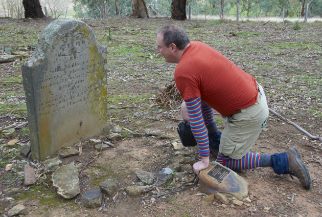 Simon reading a headstone in Pennyweight Cemetery. M Ball