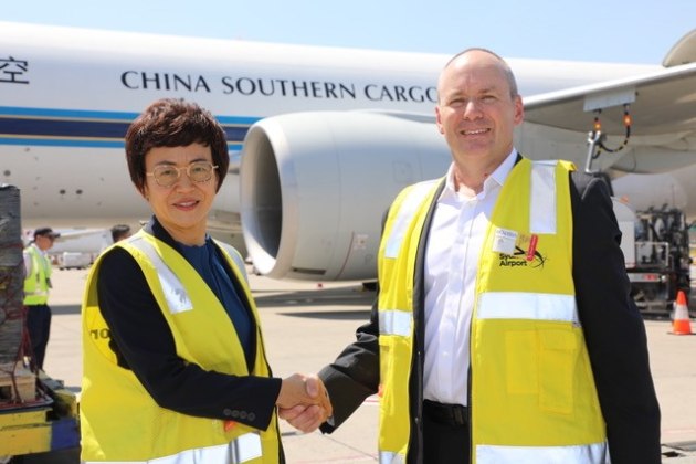 Wiseway Logistics Australia MD Florence Lee and The a2 Milk Company CEO Asia Pacific Peter Nathan on the tarmac at Sydney's Kingsford Smith Airport with the mercy dash stash destined for Wuhan.