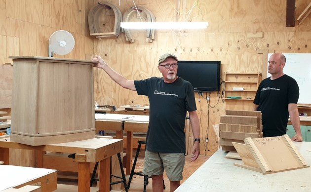 On the last day there was a walk-around discussion of the projects tackled. Here Michael is shown with Sam Harrap and the cabinet he made during the program.