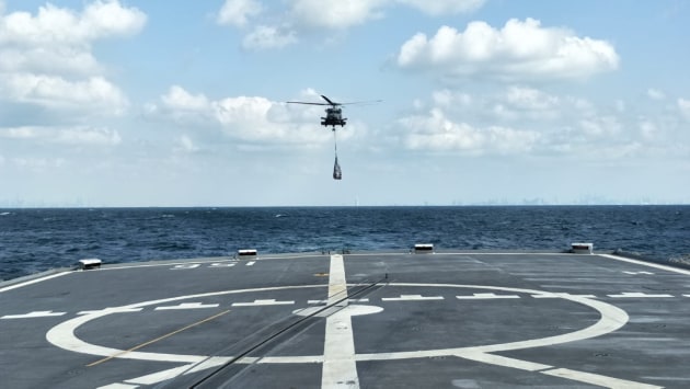 HMAS Toowoomba&rsquo;s embarked MH-60R helicopter approaches the flight deck to deliver priority stores and mail.
Defence