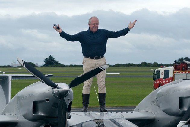 Michael Smith greets the gathering at Point Cook after completing his centenary circumnavigation re-enactment. (Phil Vabre)