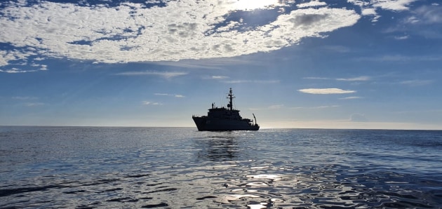HMAS Gascoyne sails in the waters of Eden Harbour.
Defence