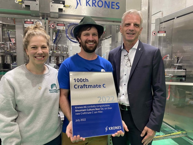 Marking the 100th Craftmate C installation with a special plaque, L-R: Mountain Culture's Harriet McCready and DJ McCready; Krones head of sales, Thomas Gerstl; Image: Food & Drink Business.