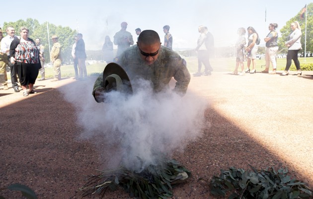 Corporal John McBeth participates in the smoking ceremony during the launch of 2020 NAIDOC Week at Russell Offices, Canberra.
Defence