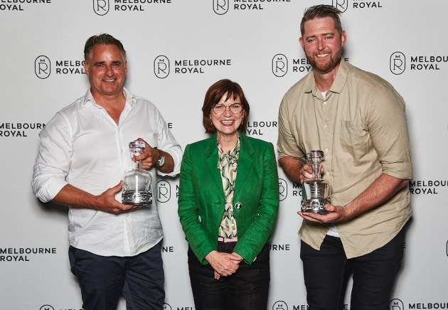 Naught Distillery Marcus Hansen, Vic Minister for Agriculture Mary-Anne Thomas and Chris Cameron accepting champion Victorian gin at the Australian Distilled Spirits Awards. (Source: Melbourne Royal) .