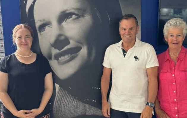 L-R: Samantha Freebairn, Greg Hood AO and Jenny Houghton in front of the photo of AAHOF inductee Nancy Bird Walton AO OBE. (Australian Aviation Hall of Fame)