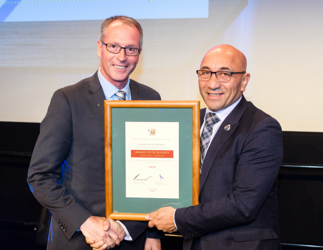 NIOA General Manager of Government Business Patrick Whitty (left) receives the award from NZ Minister of Defence, Ron Mark.
NIOA