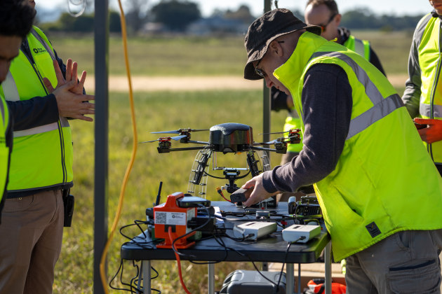 Nova Systems staff prepare a drone for flight during the trial. 

Credit: Nova Systems