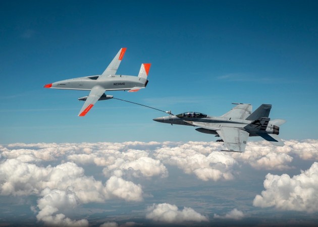 The Boeing MQ-25 T1 test asset transfers fuel to a US Navy F/A-18 Super Hornet on June 4, marking the first time in history that an unmanned aircraft has refueled another aircraft. (Credit: Boeing)