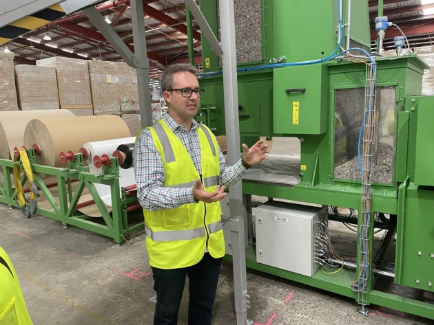 Explaining the recycled board making process: Paul Charteris, saveBoard CEO.