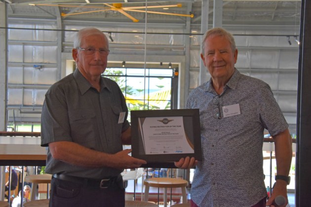Flying Instructor of the Year Peter Hales (left) is handed his award by John Douglas from Royal Aero Club of WA. (Emma Kirk / Busselton Mail)