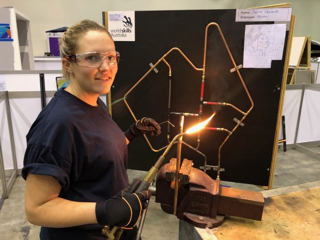 27-year-old plumbing apprentice Justine Clements at work.
Austal/NSC