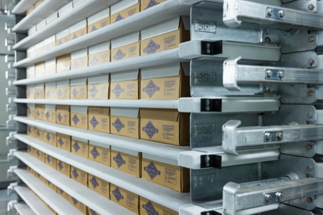 MHM&rsquo;s solution for Midfield include a Six-Mag Carton Lidder to automatically places and seals lids on cartons; an SSO Plate Freezer (pictured),  each with capacity to freeze 3072 cartons in 24 hours; an Automated Storage and Retrieval System (ASRS), for chilled and frozen products, and a Three-Cell Robotic Palletising System with auto-check scanning, stretch wrapping and labelling.