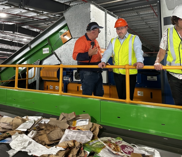 Minister Powell checks out the new recycling facility