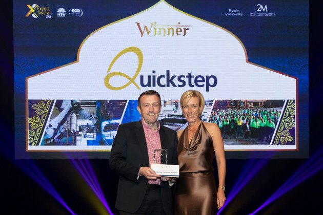 Quickstep CEO and Managing Director Mark Stewart accepts the NSW Defence Industry Award with sponsor Tea Dietterich, CEO of 2M Language Services. NSW/Quickstep