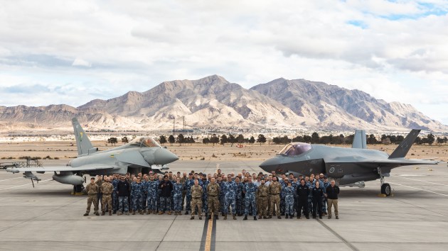 Participants in Red Flag 24-1 stand in front of an RAAF F-35A Lightning II and an RAF Typhoon FGR4.
Credit: Defence
