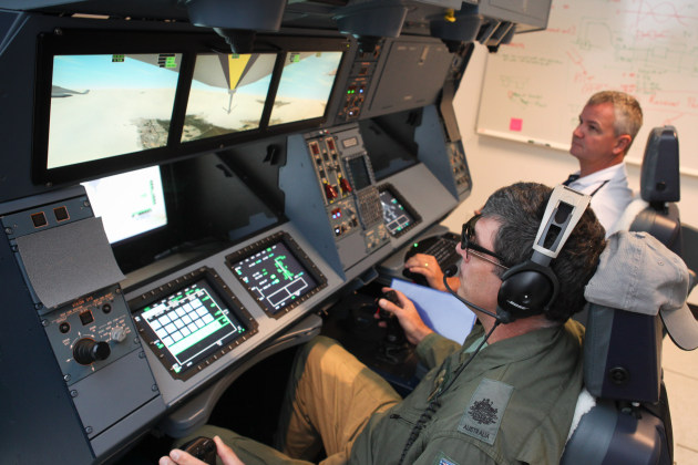 A CAE instructor supervises a KC-30A Air Refuelling Officer (ARO) during training at Amberley. (Defence)