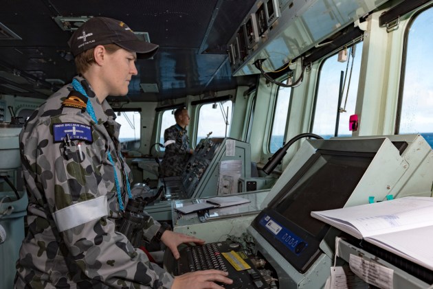 Officer of the Watch Lieutenant Ann Carroll navigates HMAS Ballarat towards a distress beacon during a search and rescue operation. Defence