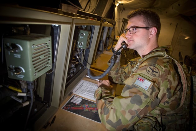 Aircraftman Brendan Greenwood monitors the Base Radio Communications Device at Williamson Airfield.
Defence
