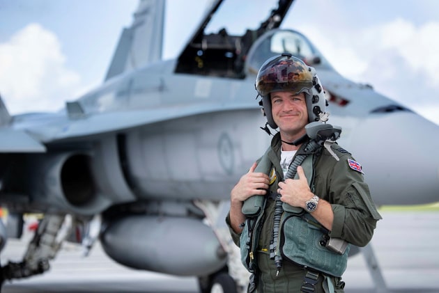 Royal Air Force exchange pilot, Flight Lieutenant Joseph Murphy stands in front of a RAAF F/A-18A Hornet.
Defence