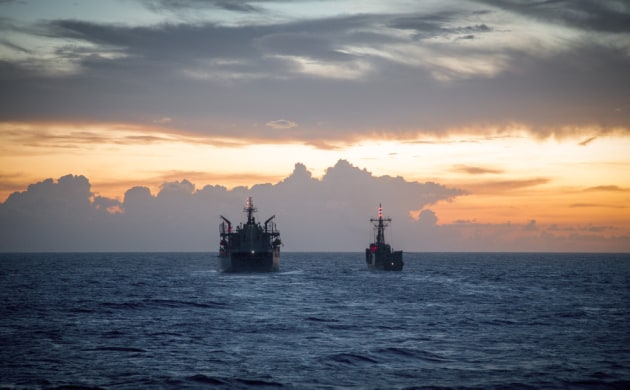 HMAS Melbourne prepares to conduct a night time replenishment at sea with HMAS Sirius while transiting in the South China Sea.
Defence