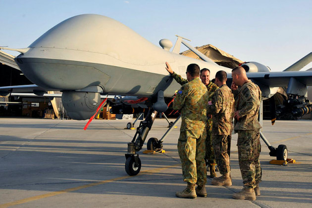 An MQ-9 Reaper under inspection by Australian soldiers at Kandahar Airfield. Credit: Defence