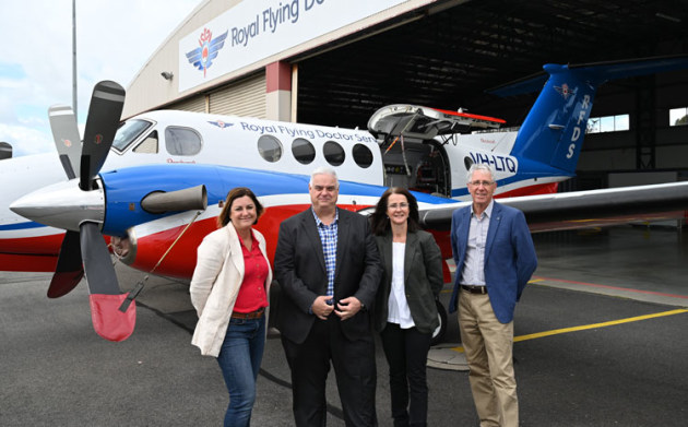 Federal Minister for Regional Development Kristy McBain, Federal Member for Lyons Brian Mitchell, RFDS Tasmania CEO Nicole Henty and RFDS Tasmania Chair Malcolm White with a King Air outside the existing Launceston base. (supplied)