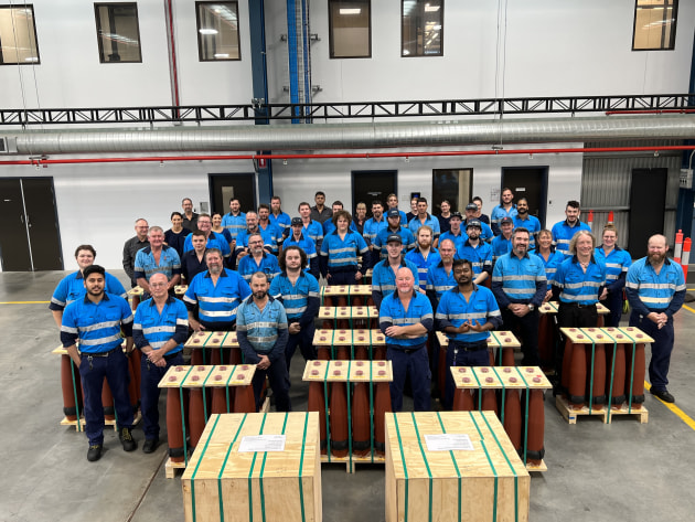 RNM staff with the first consignment of test shells exported to Germany. (Rheinmetall NIOA Munitions)