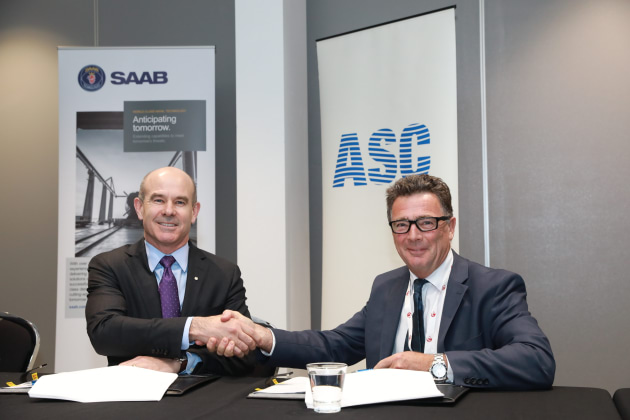 ASC CEO Stuart Whiley (R) and Saab Australia MD Andy Keough sign the agreement at the Submarine Institute of Australia conference in Canberra. Credit: ASC