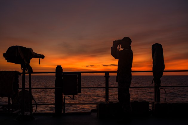 A sailor keeps watch in the Coral Sea.
Defence