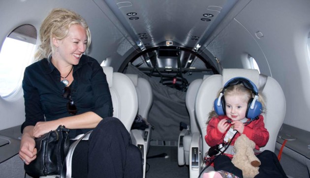 Mum Sarah and baby Lotus on Bill Bristow's Pilatus during an Angel Flight mission. (Angel Flight / Geoff Marsh)